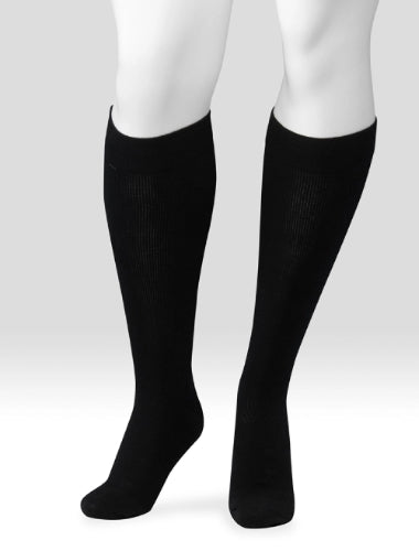 Display showing a pair of Juzo Power Wool 15-20 mmHg compression knee high socks in the color black
