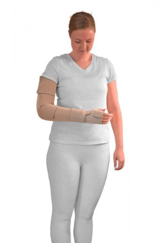Lady looking down at her beige L&R ReadyWrap Arm with attached ReadyWrap Gauntlet in the color beige