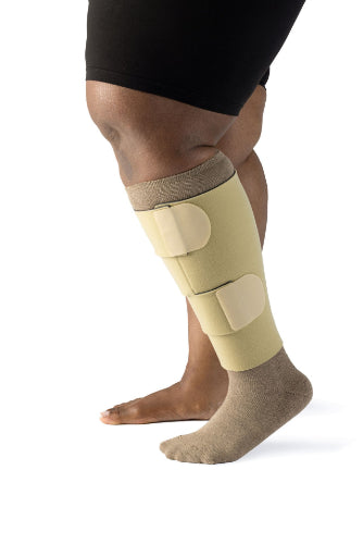 Guy wearing his Sigvaris Compreflex Contain Velcro Calf Wrap. Ideal for Lymphedema and lipoedema.