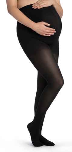 Pregnant lady wearing her Sigvaris 842M Soft Opaque Maternity Compression Stockings in the color Black