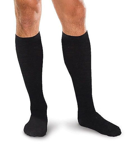 Male wearing his Therafirm Core-Spun 10-15 mmHg Compression support socks in the color Black