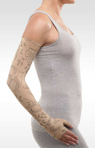 Juzo Soft Arm Sleeve with Silicone Band in the Bird Henna-Beige is available in 15-20 mmHg, 20-30 mmHg, as well as 30-40 mmHg compression levels