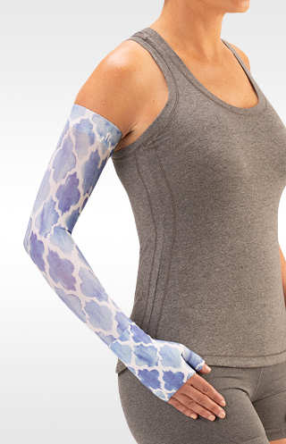 Juzo Soft Arm Sleeve with Silicone Band in the Moroccan Blue Print. Available in 15-20 mmHg, 20-30 mmHg, and 30-40 mmHg Compression