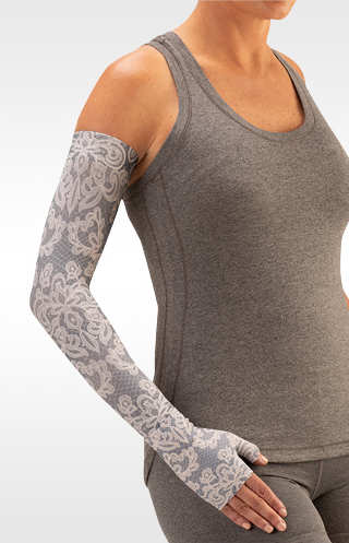 Juzo Soft Arm Sleeve with silicone band in the VINTAGE LACE Print. Available in 15-20 mmHg, 20-30 mmHg Compression
