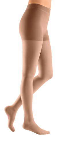 Woman wearing Mediven Plus Closed Toe Waist High 20-30 mmHg Compression Stockings in the Color Beige