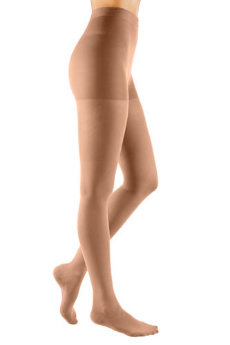 Woman wearing her Mediven Comfort Compression Pantyhose in the color Natural