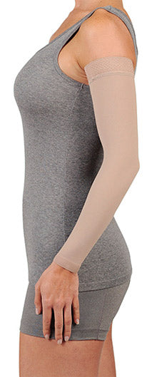 Lady wearing her Juzo Soft 30-40 mmHg Compression Arm Sleeve in the color Beige