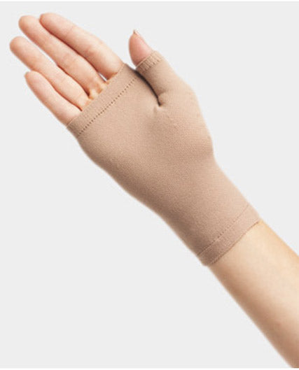 Lady's hand wearing the Juzo Seamless 2302AC14 Gauntlet 30-40 mmHg in the color beige