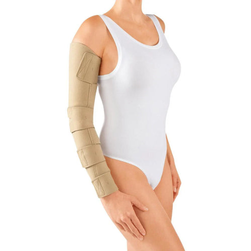 Lady posing in a white leotard wearing a beige Circaid JuxtaFit Essentail velcro wrap