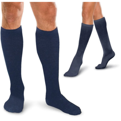 Man and woman wearing their Therafirm Core-Spun 10-15 mmHg Compression support socks in the color Navy