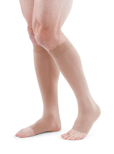 Man wearing his Medi Duomed Advantage Open Toe Compression Stockings in the color Beige