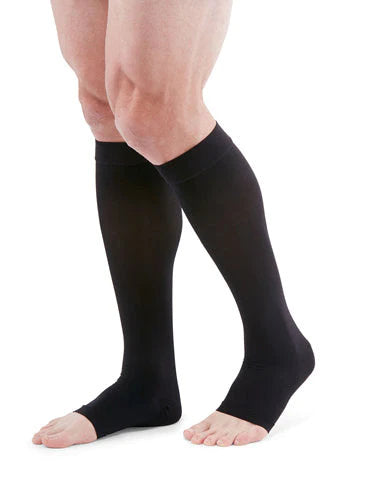 Man wearing his Medi Duomed Advantage Open Toe Compression Stockings in the color Black