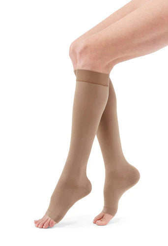 Lady wearing her Medi Duomed Advantage Open Toe Compression Stockings in the color Almond
