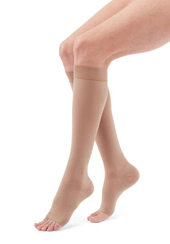 Lady wearing her Medi Duomed Advantage Open Toe Compression Stockings in the color Beige