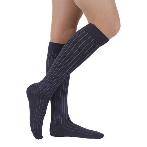 Person wearing Medi's new Duomed Soft Stripe compression sock in the color gray.