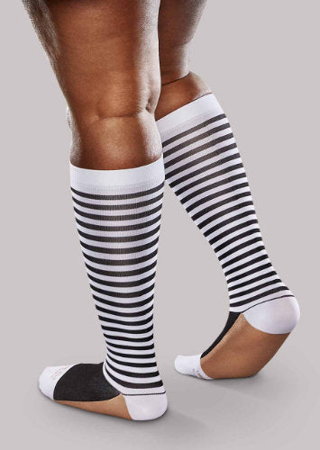Lady wearing her Natural Stripe Ease Bold Patterned 15-20 mmHg Compression Knee High Socks