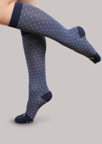 Lady wearing her Starry Night Ease Bold Patterned 20-30 mmHg Compression Knee High Socks