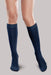 Lady's leg wearing the Ease Microfiber compression stocking by Therafirm in the color Navy