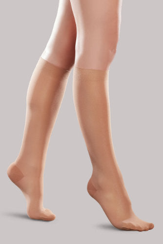 Lady's leg wearing the Ease Microfiber compression stocking by Therafirm in the color Sand