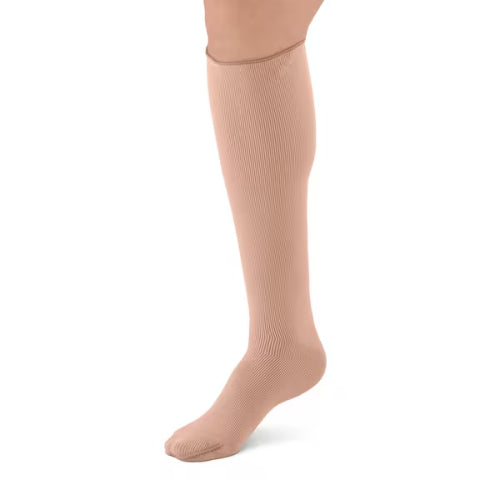 Person wearing the L&R ExoStrong below knee compression stocking with closed toe.