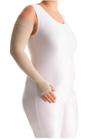 Lady in a white bodysuit wearing her JOBST 15-20 mmHg Bella Lite Arm Sleeve Gauntlet combo in the color beige