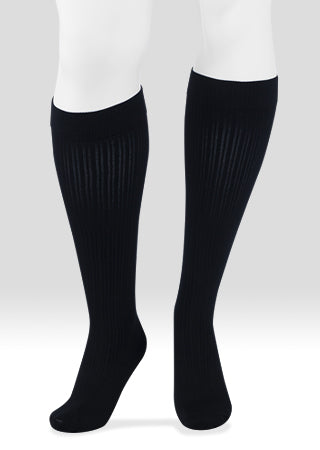 Mannequin leg displaying the Juzo Power Cotton 2660AD 15-20 mmHg compression ribbed knee highs in the color black.