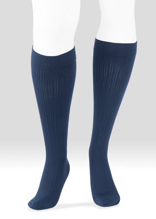 Mannequin leg displaying the Juzo Power Cotton 2660AD 15-20 mmHg compression ribbed knee highs in the color navy.