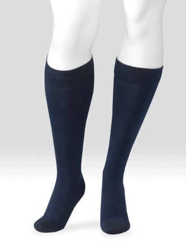 Display showing a pair of Juzo Power Wool 15-20 mmHg compression knee high socks in the color navy