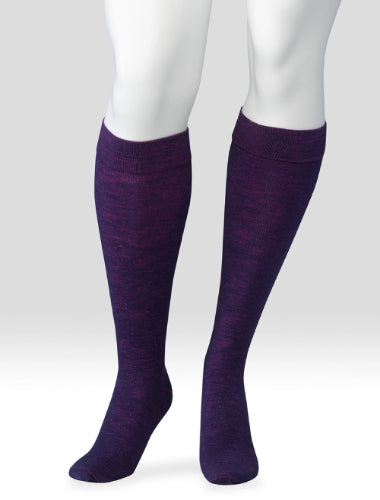 Display showing a pair of Juzo Power Wool 15-20 mmHg compression knee high socks in the color purple haze