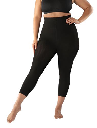 Lady smiling while wearing her new Juzo Sensation compression Capris that are made for lipedema. In the color black.