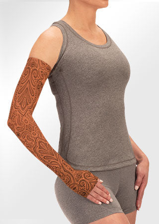 Juzo Soft Arm Sleeve with Silicone Band in the Paisley Henna Cinnamon Print. Available in 15-20 mmHg, 20-30 mmHg, and 30-40 mmHg Compression