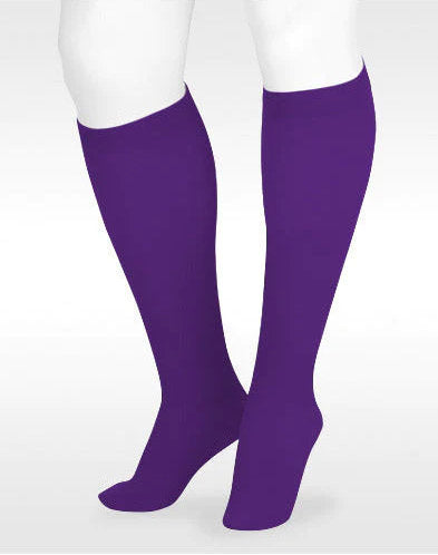 Display leg showing the Juzo Soft Closed Toe Knee High 20-30 mmHg Compression Stockings wtih Silicone Band in the Juzo Trend Color Amethyst