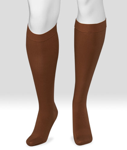 Display showing the Juzo Soft Knee High Closed Toe 15-20 mmHg Compression Stocking Color Mocha