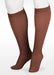 Display showing the Juzo Soft Knee High Closed Toe 15-20 mmHg Compression Stocking Color Chocolate