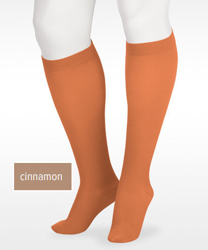 Display showing the Juzo Soft Knee High Closed Toe 15-20 mmHg Compression Stocking Color Cinnamon