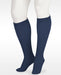 A display showcasing the Juzo Soft Closed Toe Knee High with Silicone Band in the Color Navy