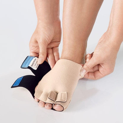 Image of someone putting on their Lohmann and Rauscher ReadyWrap Toe in the color beige.