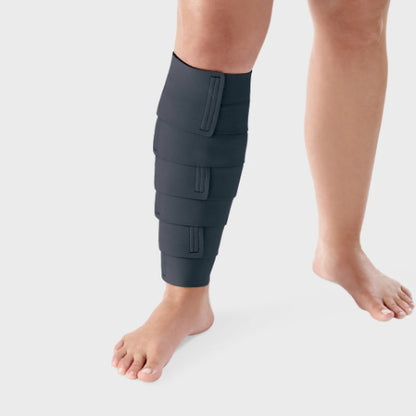 Person wearing a black Lohmann & Rauscher ReadyWrap Calf compression wrap.