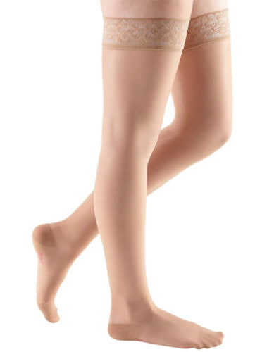Lady wearing her Mediven Sheer and Soft Thigh High Compression Stockings in the color Toffee