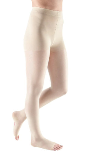 Woman wearing Mediven Sheer and Soft 20-30 mmHg Compression Pantyhose in the color Wheat