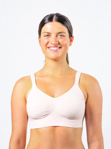 Woman wearing the Prairie Wear Hugger Aria compression bra in the color Wild Rose