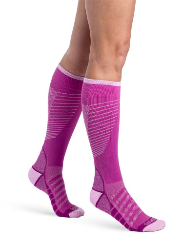 Lady wearing her new Sigvaris 432C Motion Flow Tech 20-30 mmHg compression socks in the color orchid