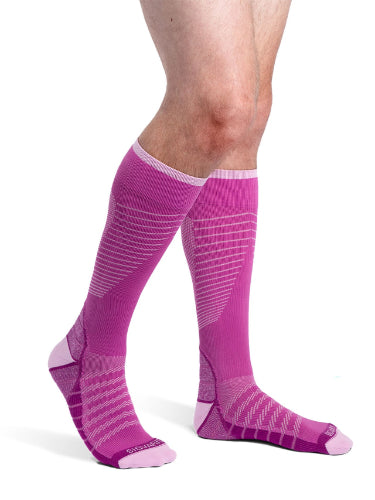 Man wearing his new Sigvaris 432C Motion Flow Tech 20-30 mmHg compression socks in the color orchid