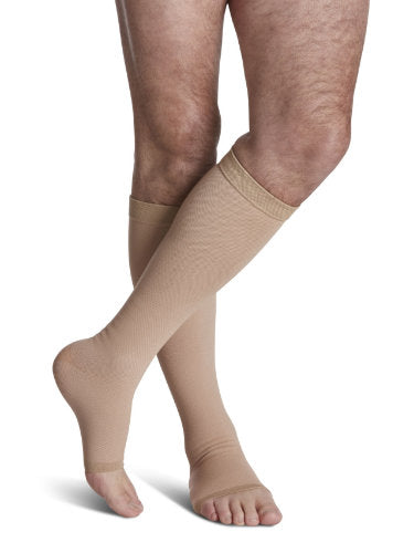 Sigvaris 504C Natural Rubber 40-50 mmHg Compression Open Toe Stockings Color Beige on a Mans leg