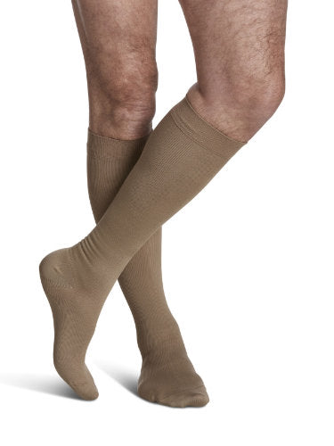 Male wearing Sigvaris 823C Microfiber 30-40 mmHg Compression Knee High Socks in the color Tan-Khaki