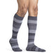 Male wearing his Sigvaris Microfiber Pattern 20-30 mmHg compression knee high in the design graphite stripes.