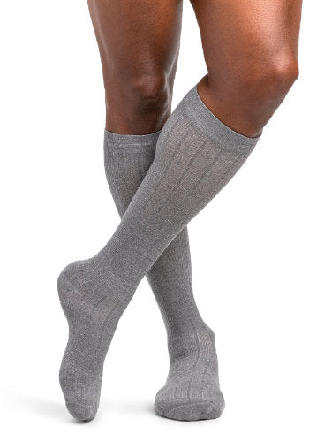 Male wearing his Sigvaris Linen 252CM 20-30 mmHg Compression Socks color Light Grey
