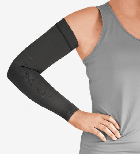Woman wearing her black colored Solaris ExoStrong Arm Sleeve with Silicone Band.