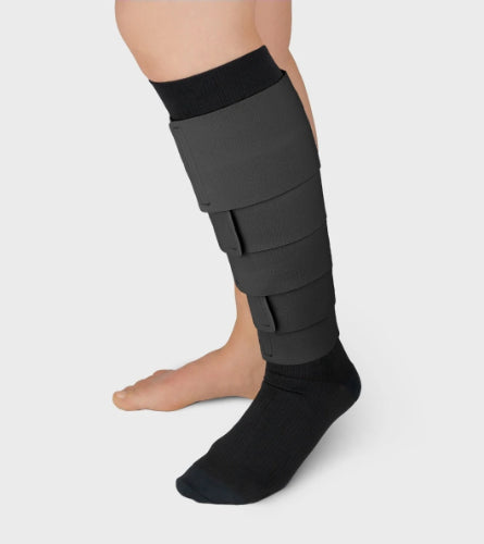 Person wearing the Solaris ReadyWrap Fusion Kit on their left leg in the color black.