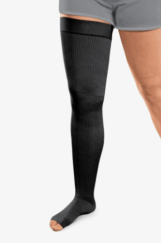 Person wearing a black colored Solaris ExoStrong Flat-Knit compression thigh-high with open toe